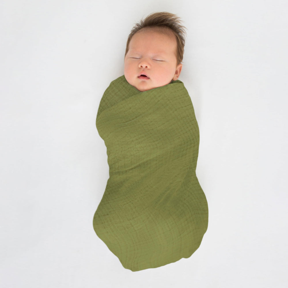 SwaddleDesigns blanket used as stroller sunshield on sunny day.