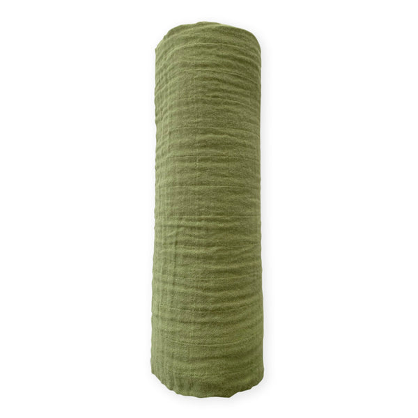SwaddleDesigns cotton muslin swaddle blanket with green turtle motif for breathable comfort.