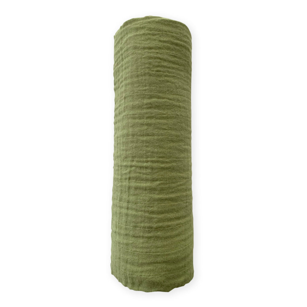 SwaddleDesigns cotton muslin swaddle blanket with green turtle motif for breathable comfort.
