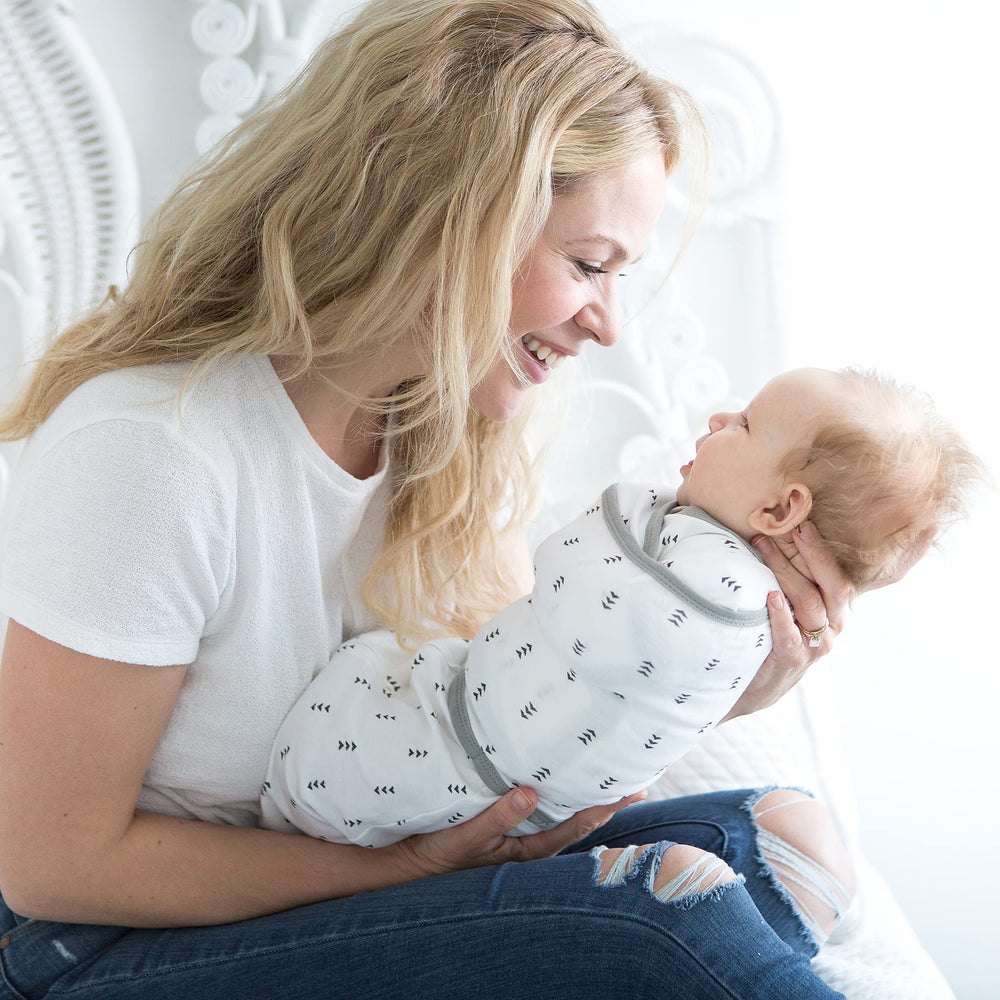 SwaddleDesigns 2-way zipper and snug wrap support quick diaper changes.