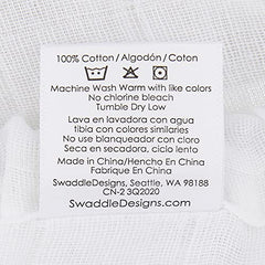 SwaddleDesigns elastic-bottom sheet keeps standard crib mattresses snug