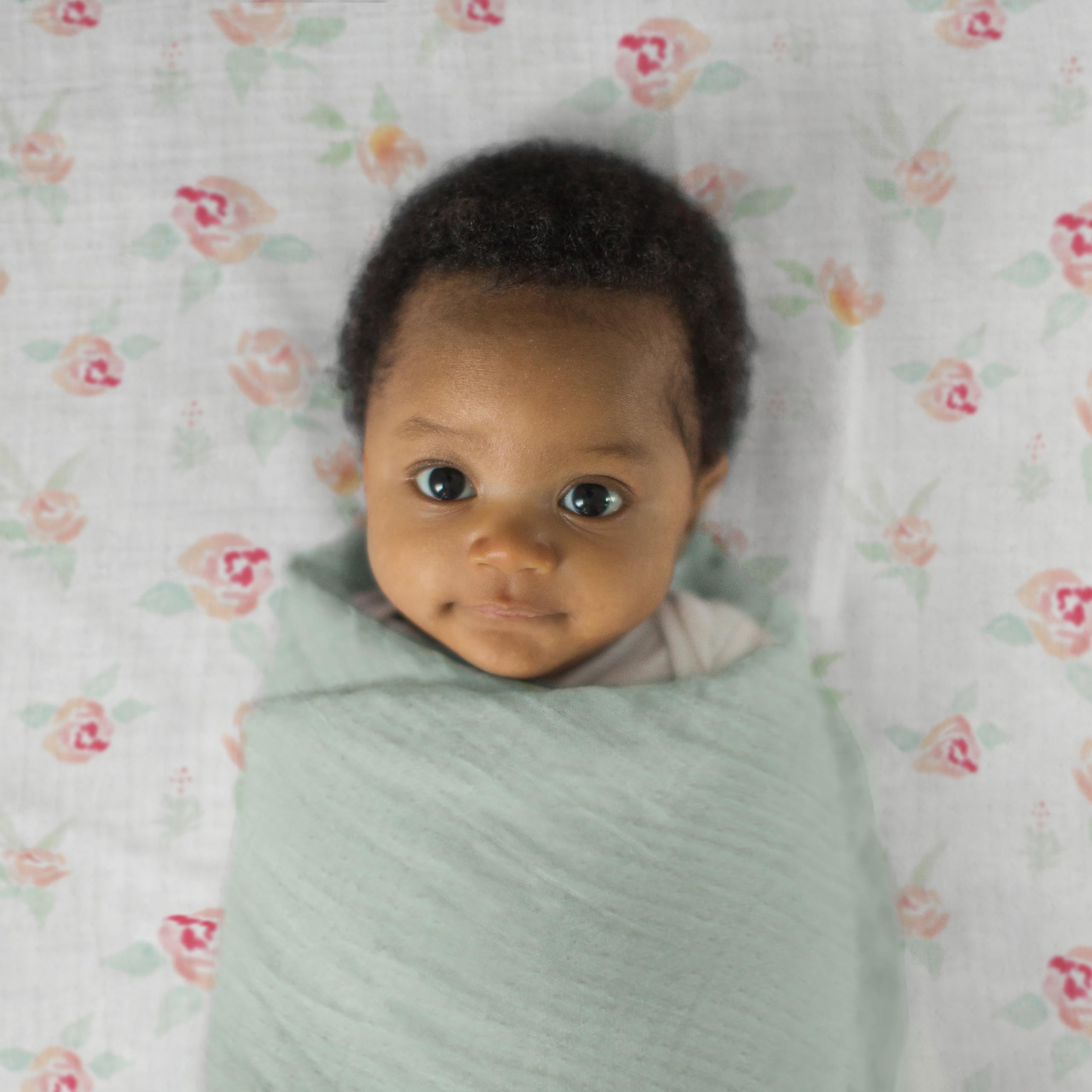 Jadeite swaddle used as sunshield on a stroller during a sunny outing.