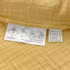 SwaddleDesigns sunshield-stroller image, lightweight muslin shades baby on outings.