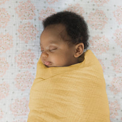 SwaddleDesigns tummy-time-blanket, soft muslin supports tummy play sessions.