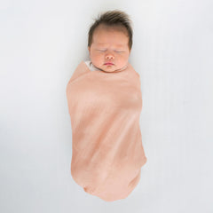 SwaddleDesigns versatile blanket used as sunshield and nursing cover.