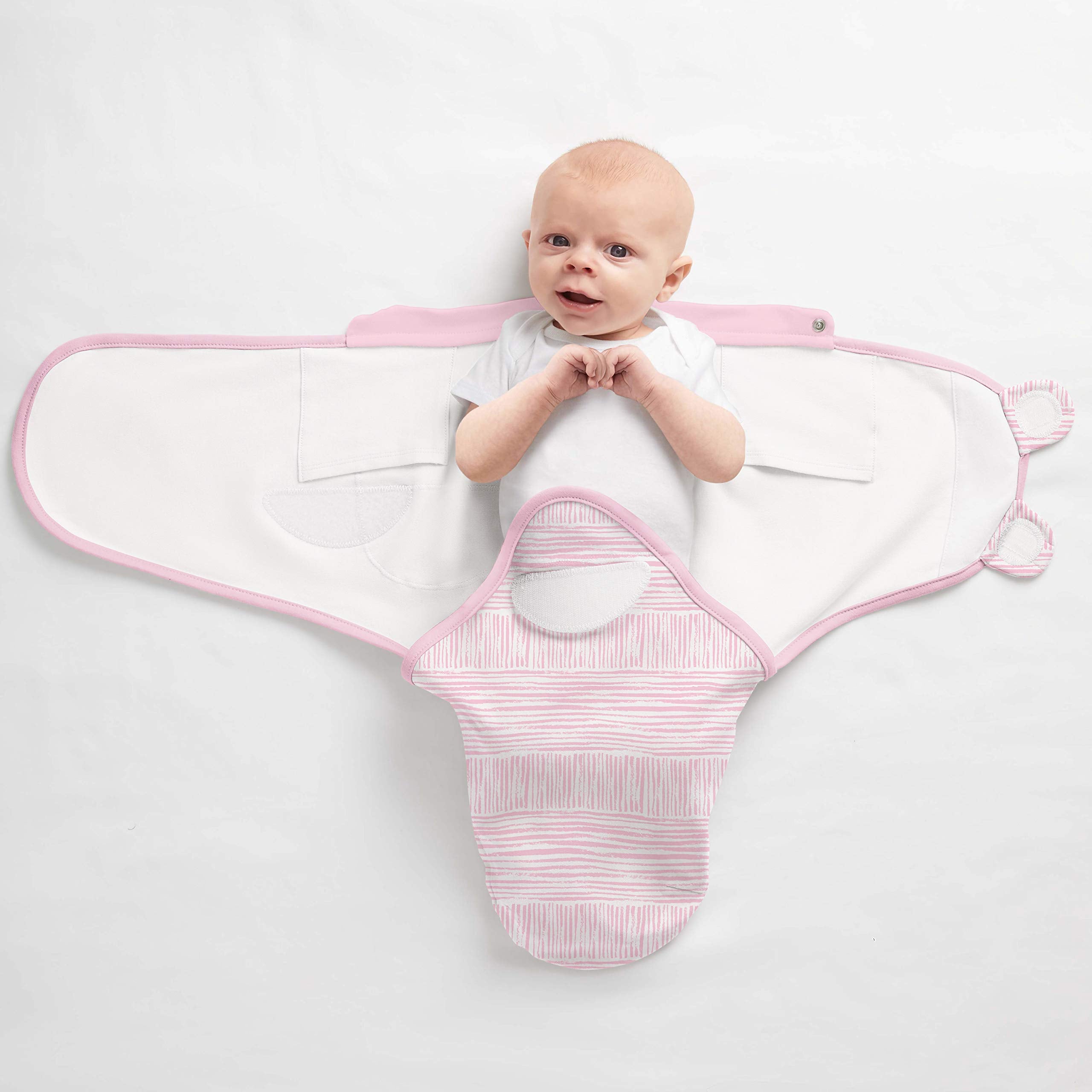 SwaddleMe arms-over-chest position for a cozy, womb-like feeling.