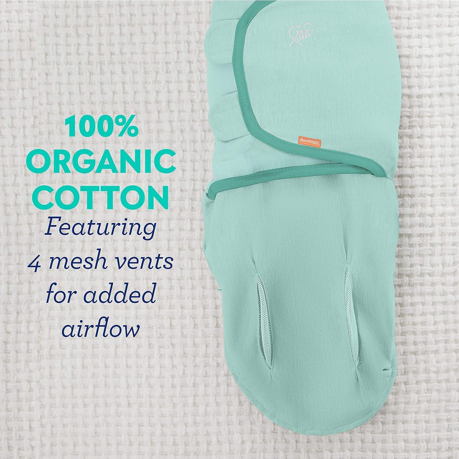 Infant in SwaddleMe Luxe Perfect Temp Swaddle demonstrating cozy wrap