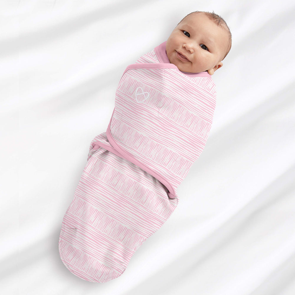 SwaddleMe size small/medium fits 0–3 months, 7–14 lbs, up to 26 inches.