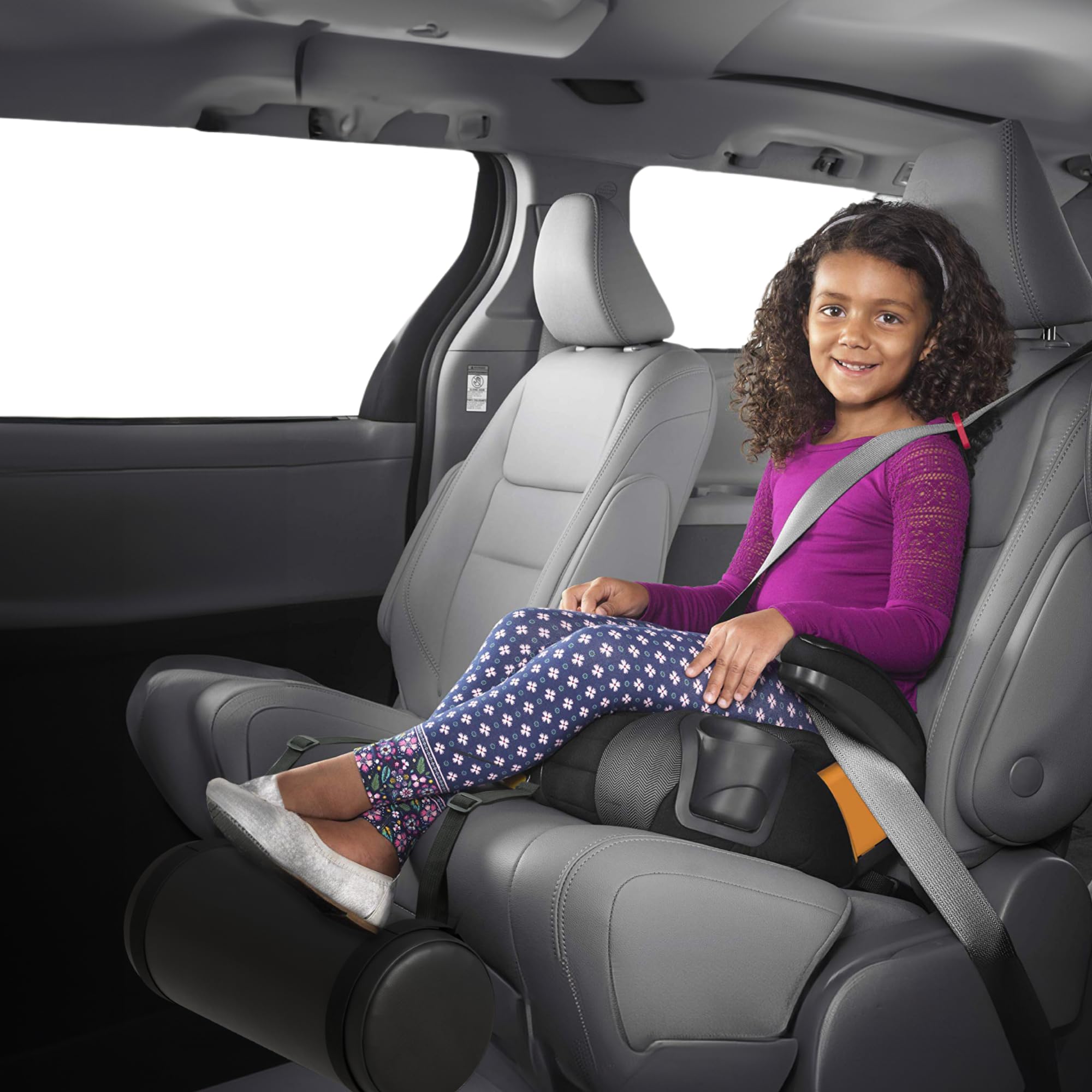Adjustable-fit Swanoo foot rest shown on a booster seat for growing kids