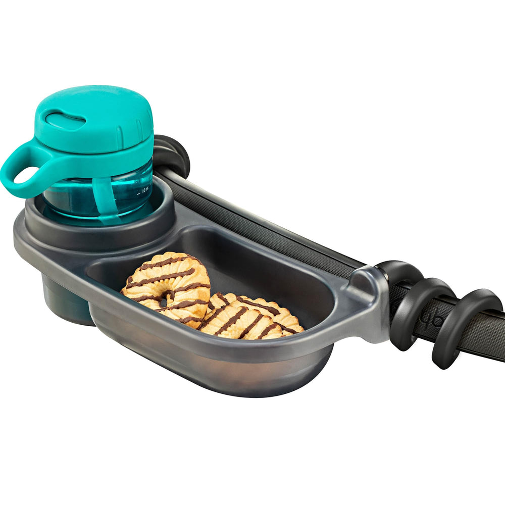 Swanoo snack tray in use during a family outing on a stroller.