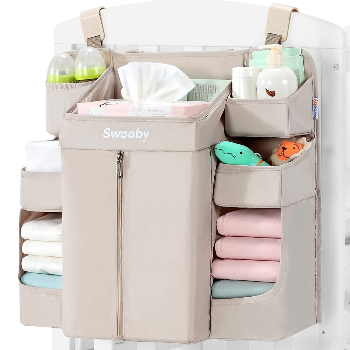 Sweeby diaper organizer hangs on changing table with easy diaper access