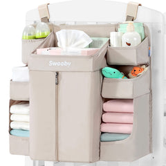 Sweeby diaper organizer hangs on changing table with easy diaper access