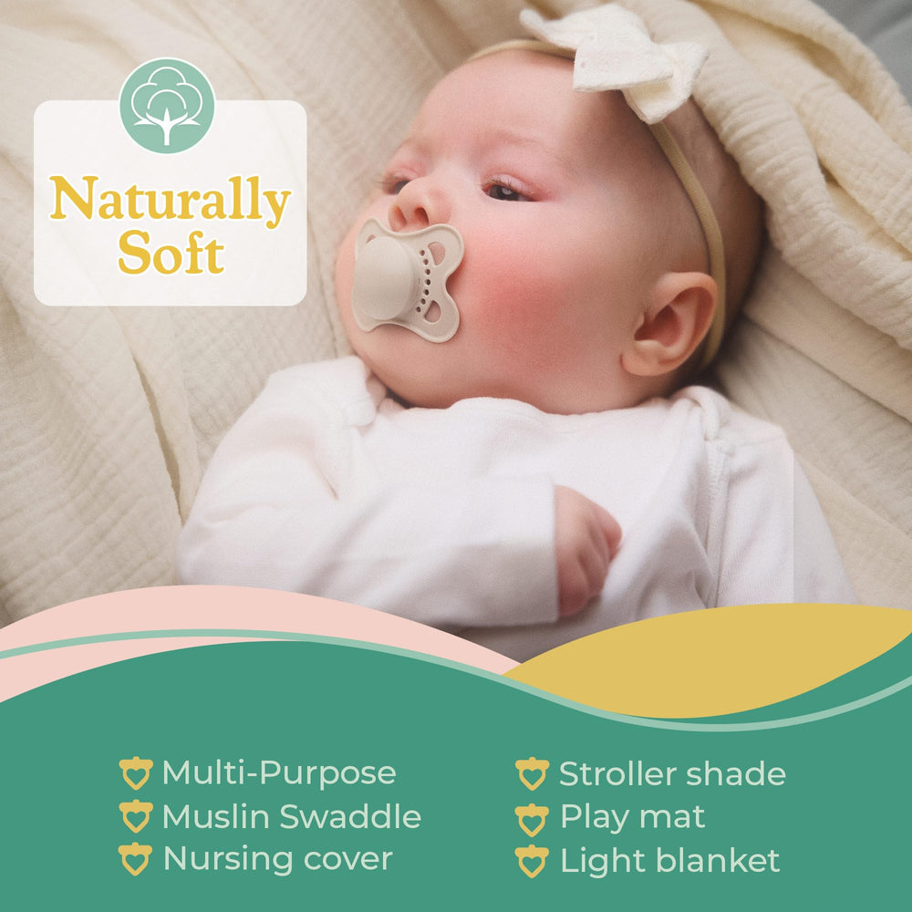 Sweet Acorn teals and whites swaddle in nursery setup.