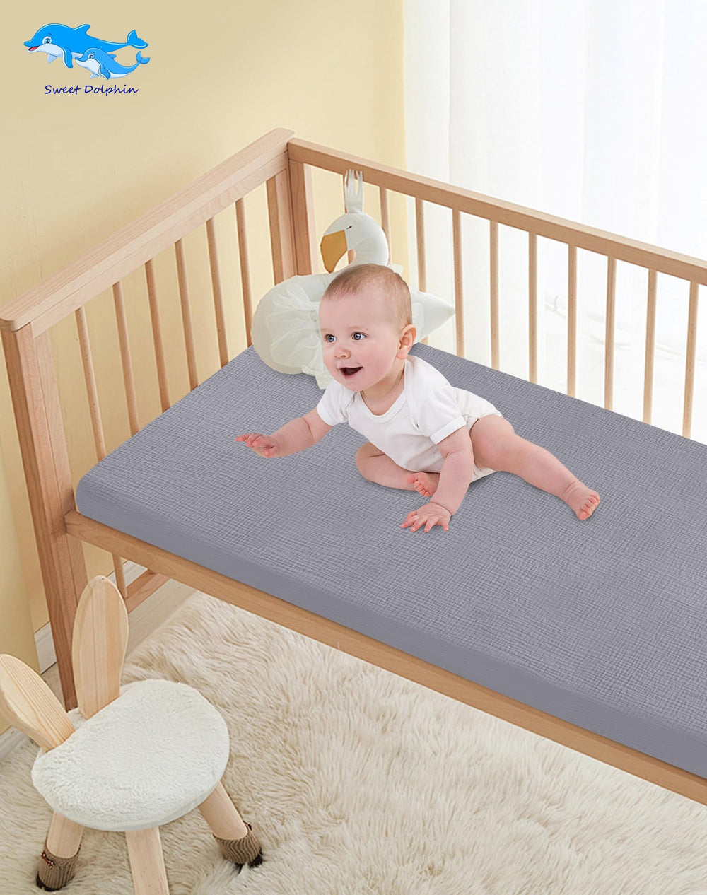 In-use Sweet Dolphin crib sheets providing a neat, cozy sleep surface.