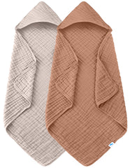 Sweet Dolphin muslin hooded baby towel 32x32 in use after bath, providing gentle warmth.