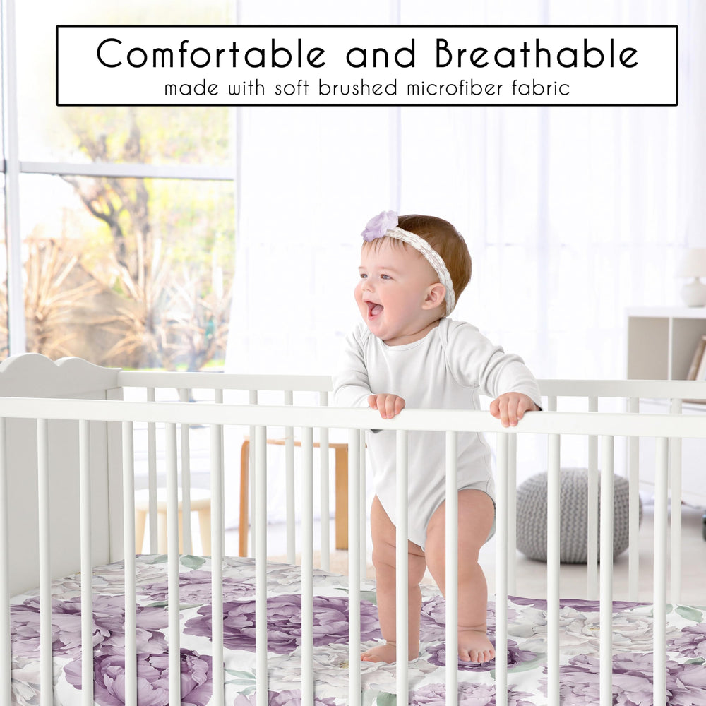 Sweet Jojo Designs boho purple floral fitted sheet on crib demonstrating secure fit