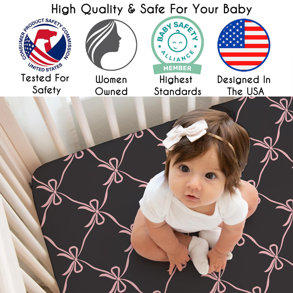 Black and blush bows print adds ballet-inspired charm to the nursery.