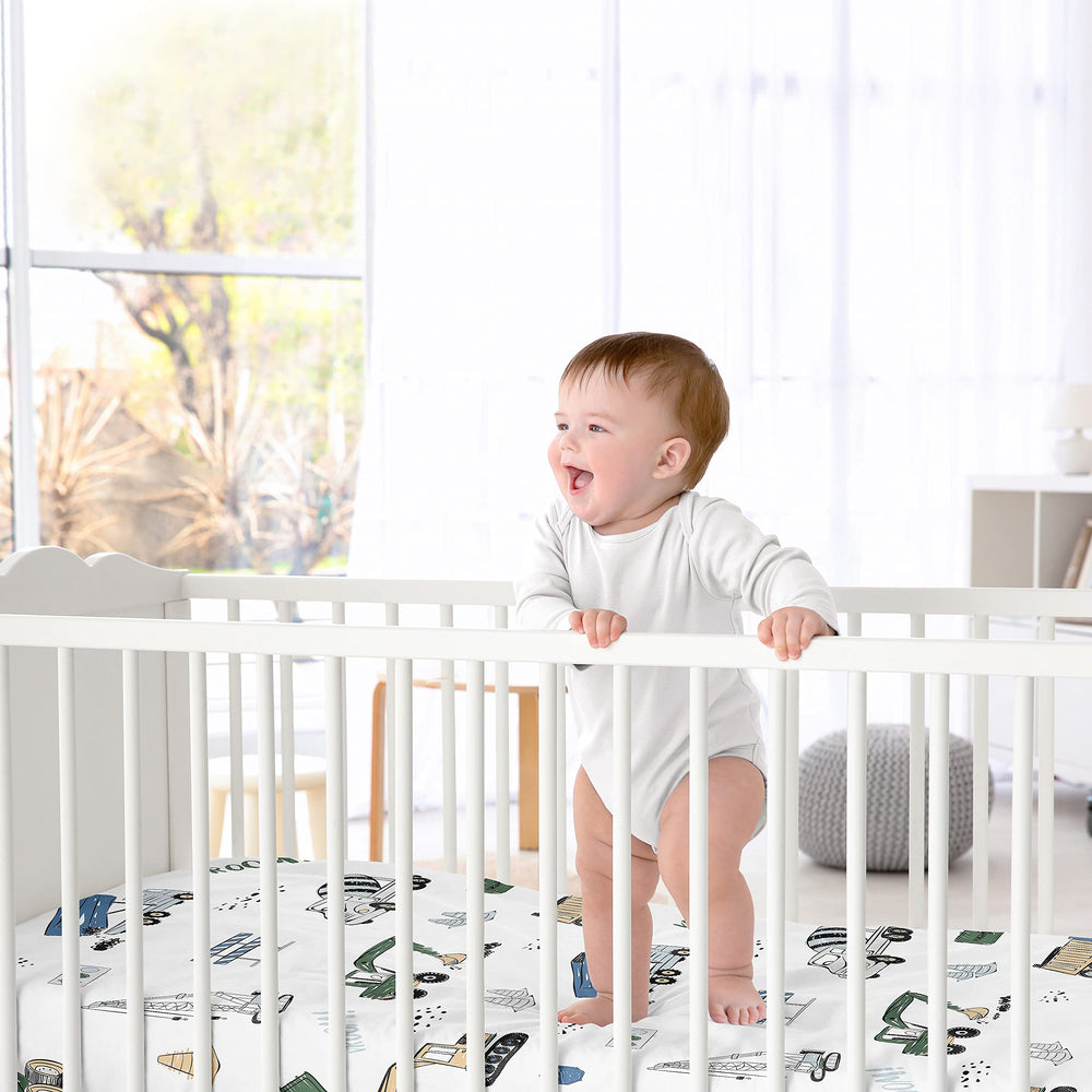 Sweet Jojo Designs cement mixer print crib sheet adds busy, fun detail for baby bed.