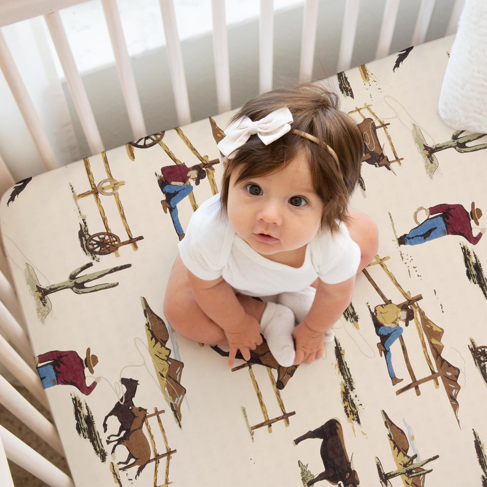Sweet Jojo Designs cow print crib sheet with durable easy-care fabric