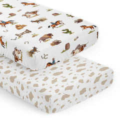 Sweet Jojo Designs cow-print crib sheet; snug fit for standard cribs.