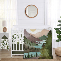 Sweet Jojo Designs crib comforter with forest tree print for a cozy nursery look