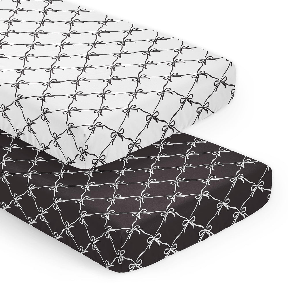 Sweet Jojo Designs crib sheets with a snug fit and bows create a calm nursery.