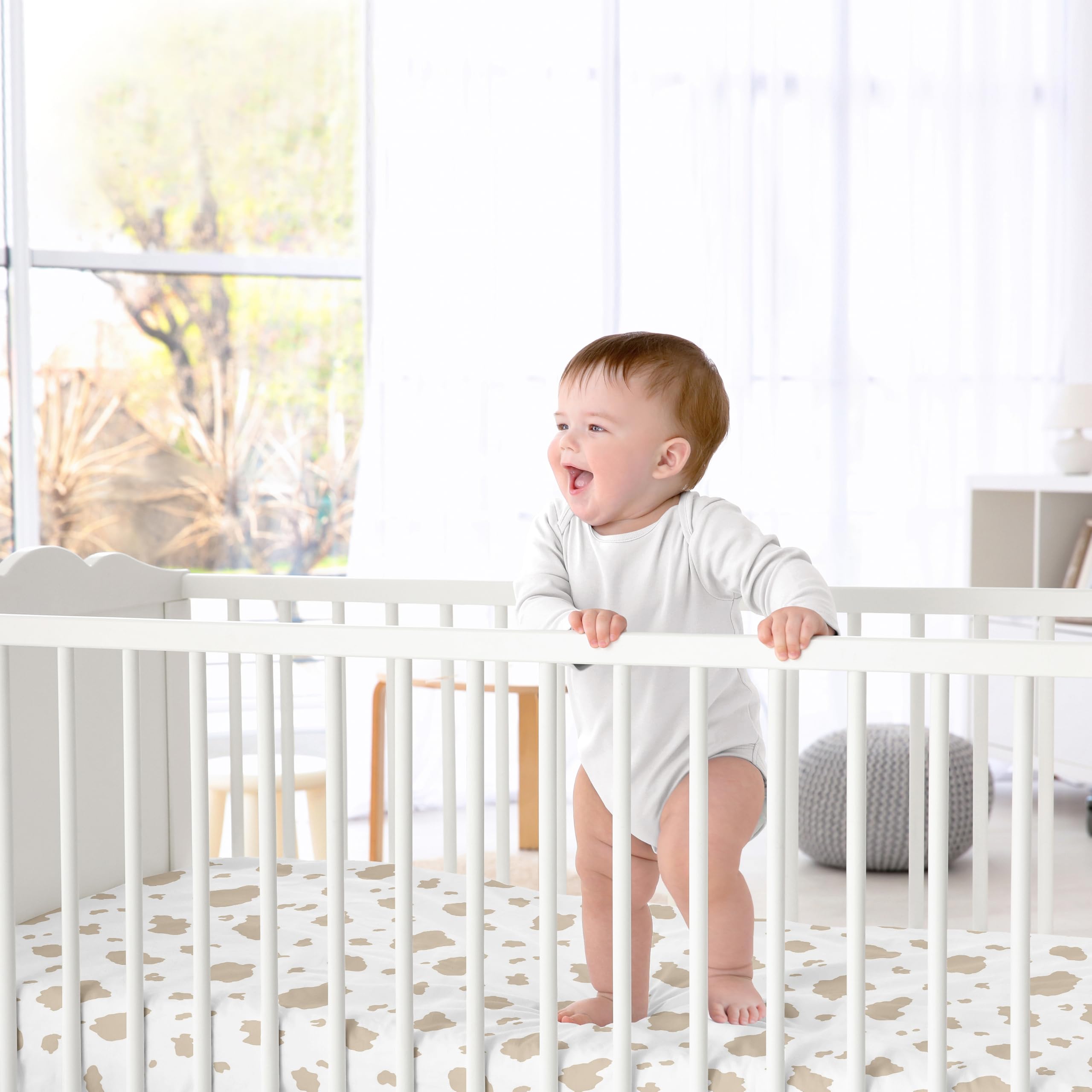 Sweet Jojo Designs farm-animal print crib sheet; durable fabric for busy families.