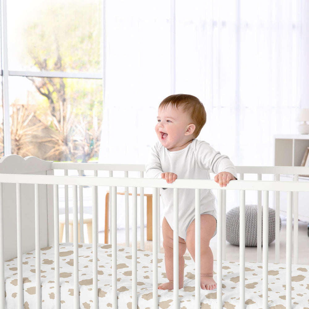 Sweet Jojo Designs farm-animal print crib sheet; durable fabric for busy families.