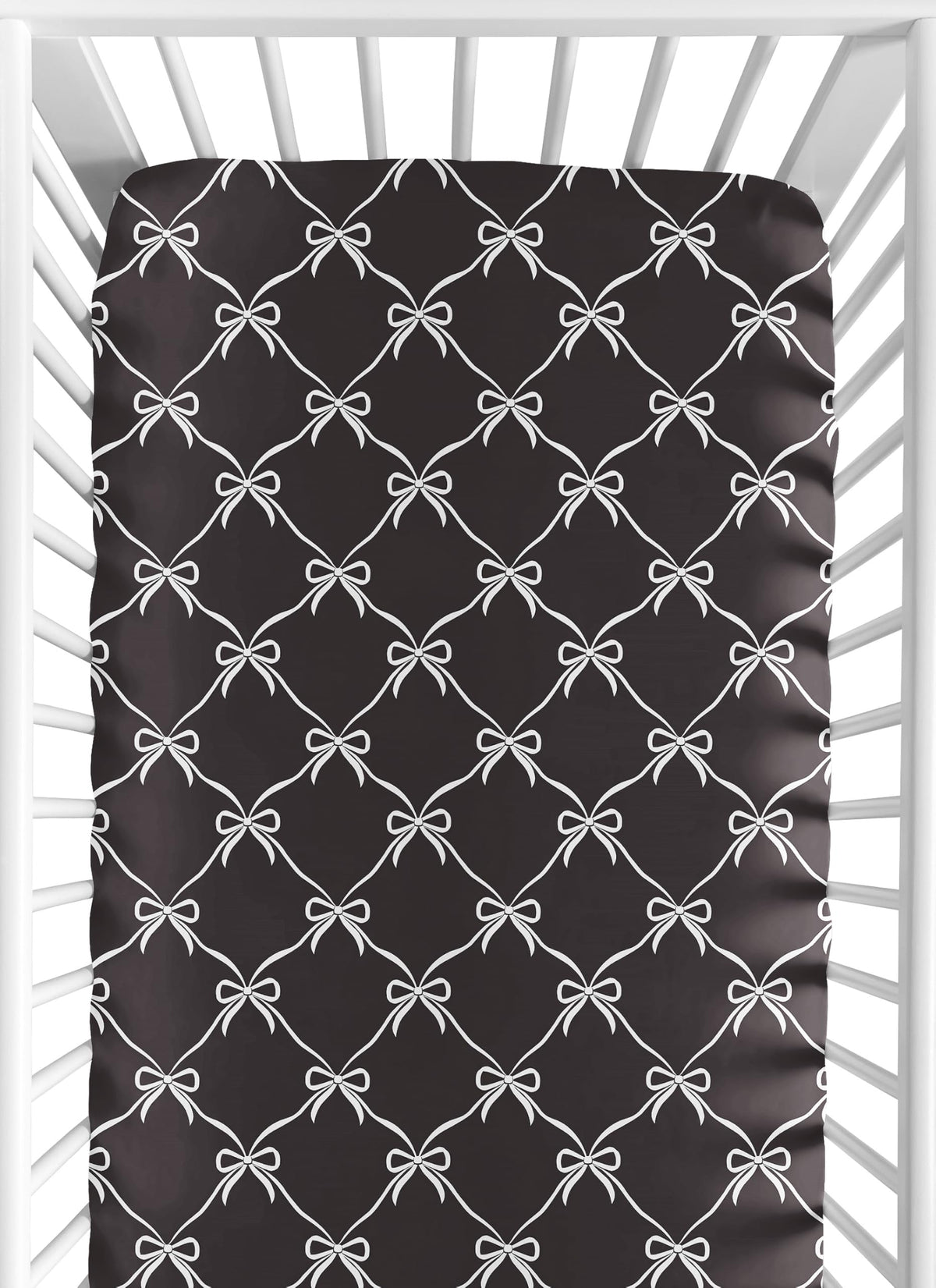 Sweet Jojo Designs fitted crib sheet with black and white bows creates a cozy sleep space.