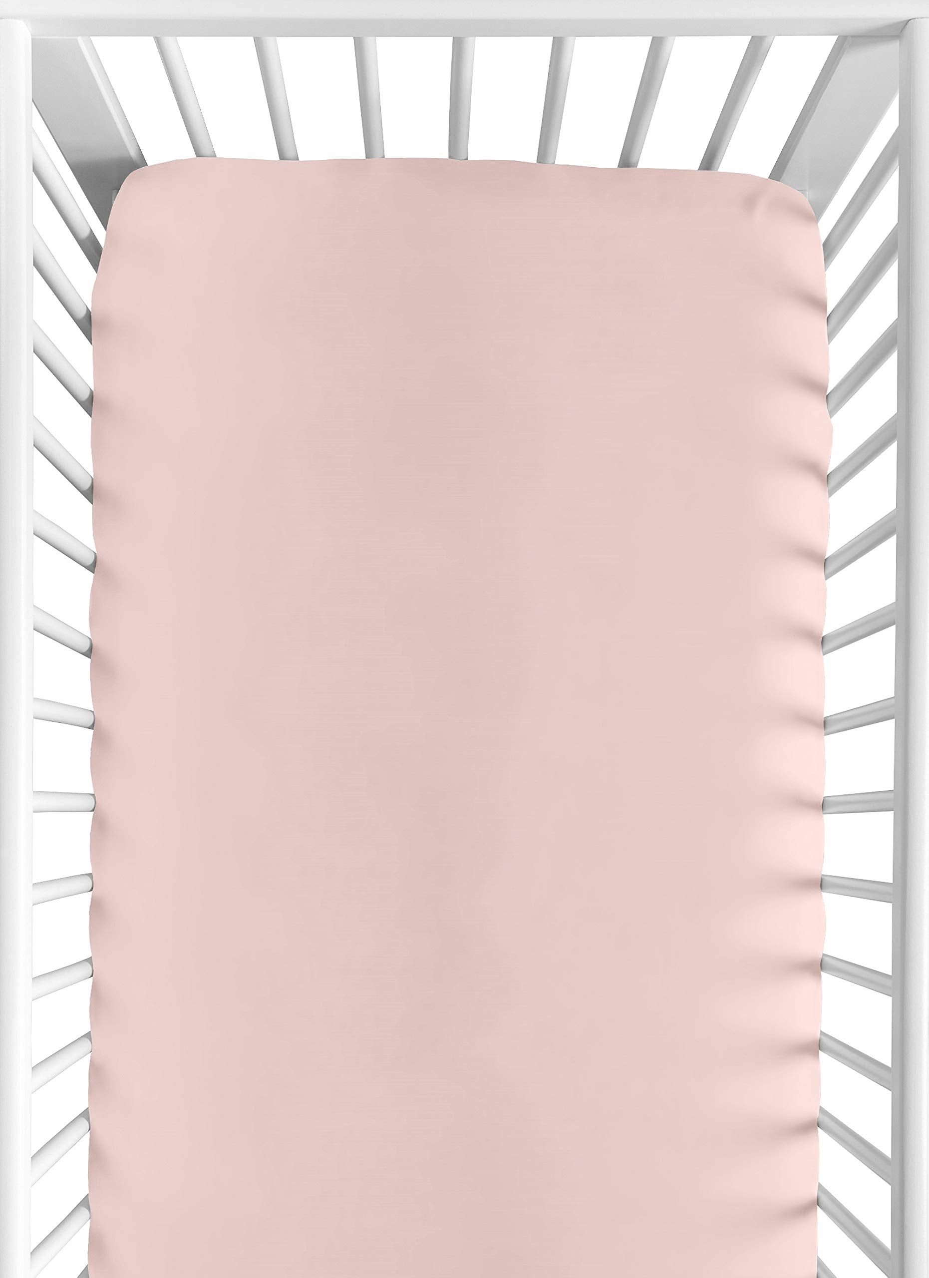 Sweet Jojo Designs fitted crib sheet in solid pink for a cozy newborn sleep.