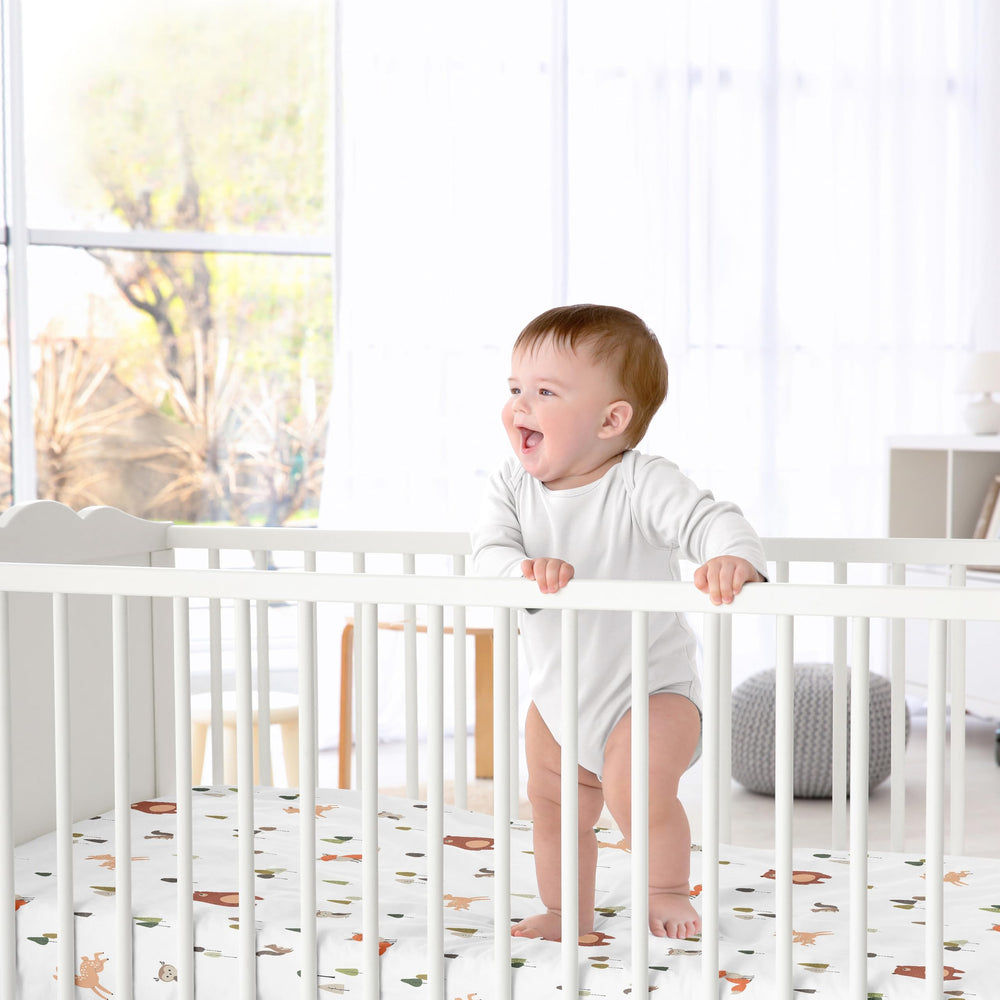 Sweet Jojo Designs forest animals brown bear crib sheet with snug fit for standard cribs.