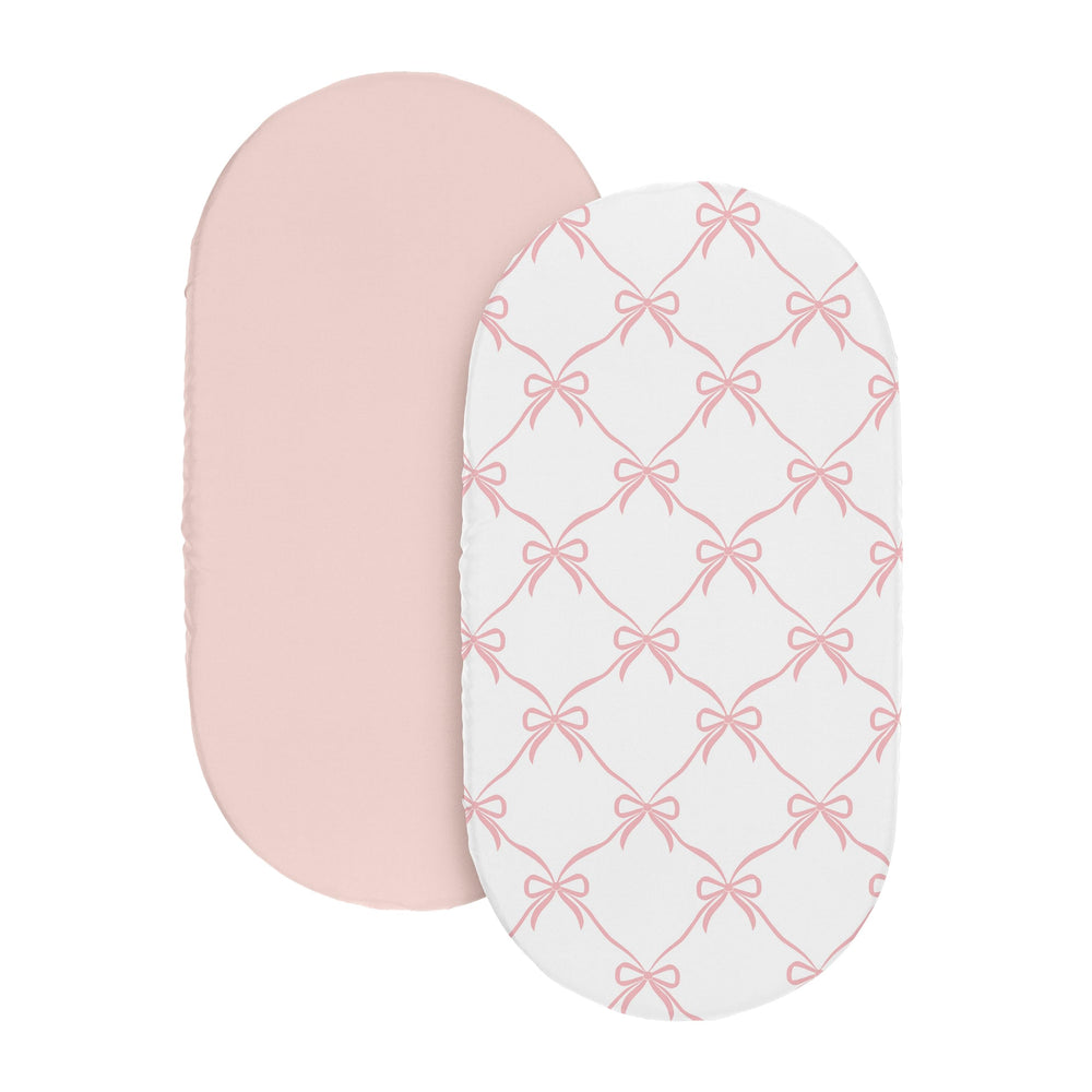 Sweet Jojo Designs bassinet sheets on oval bassinet, easy to change and keep baby comfy