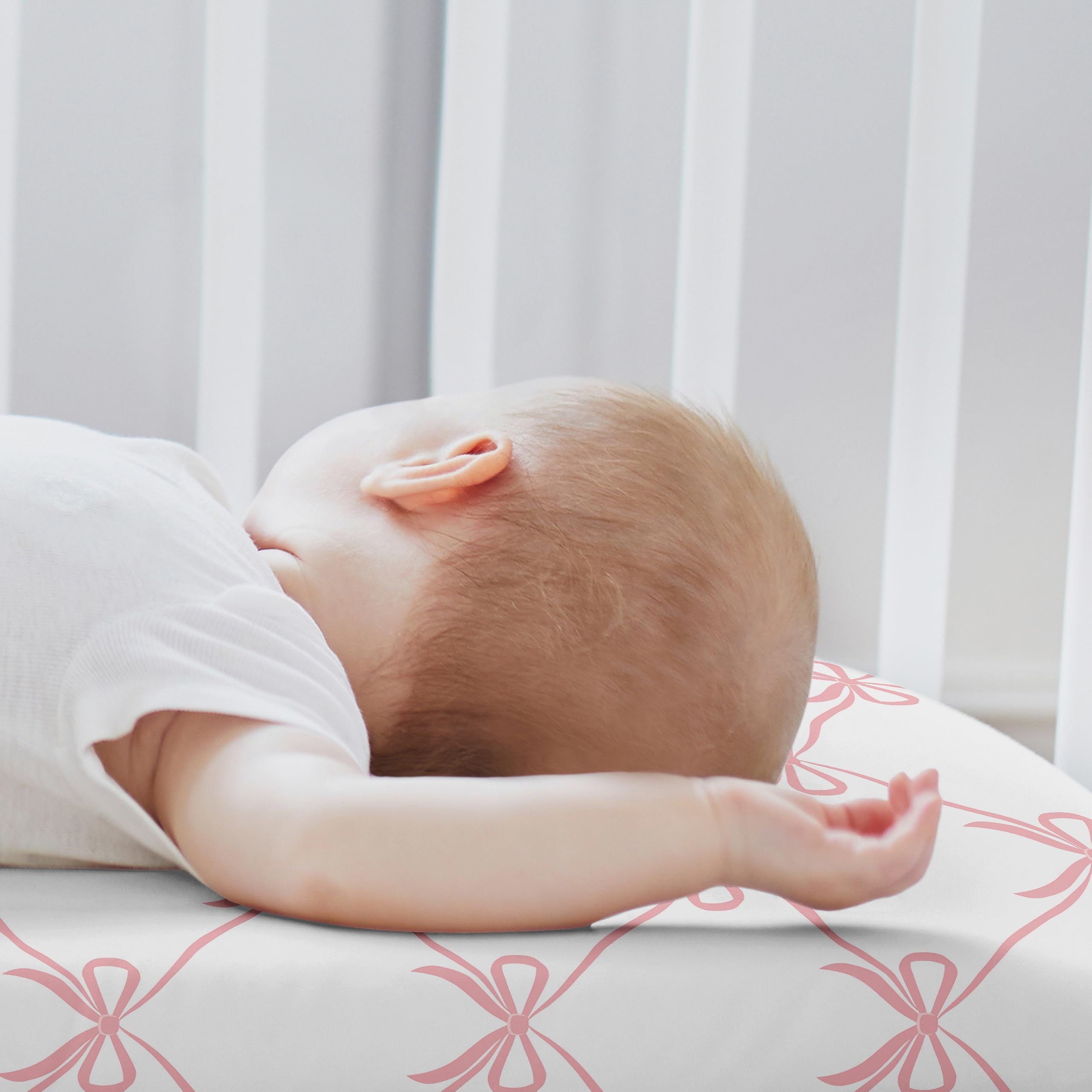 Sweet Jojo Designs 2-piece set with blush and white bows enhances nursery decor