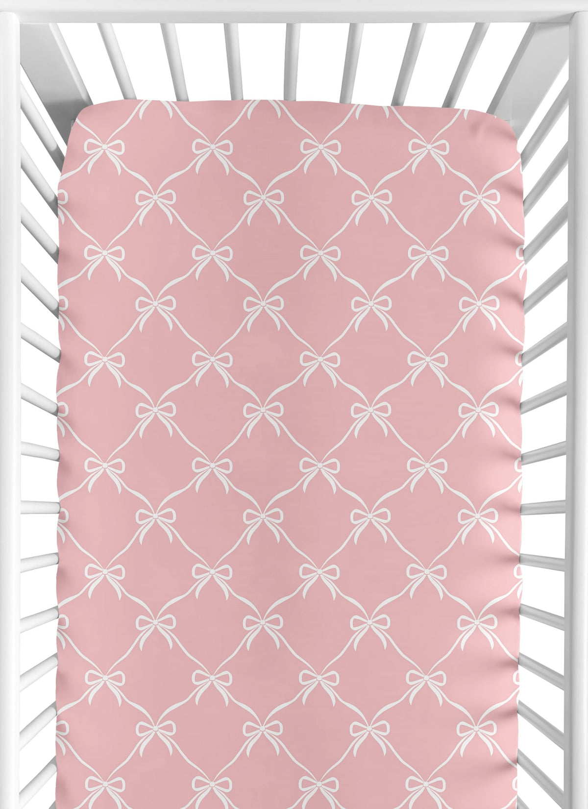 Sweet Jojo Designs pink bows crib sheet closeup, soft brushed microfiber for gentle baby sleep.