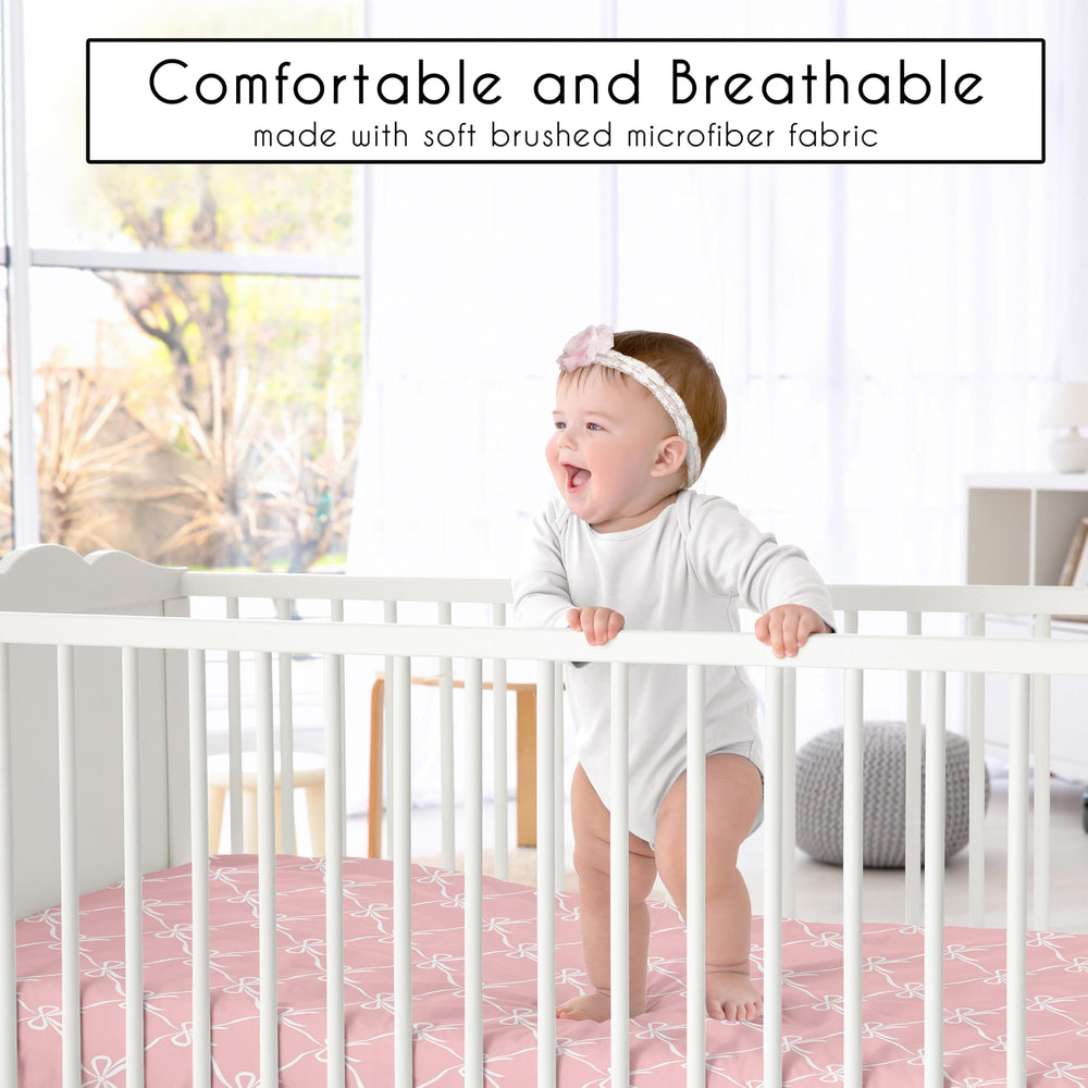 Sweet Jojo Designs pink bows crib sheet snug-fit on crib for secure mattress coverage.