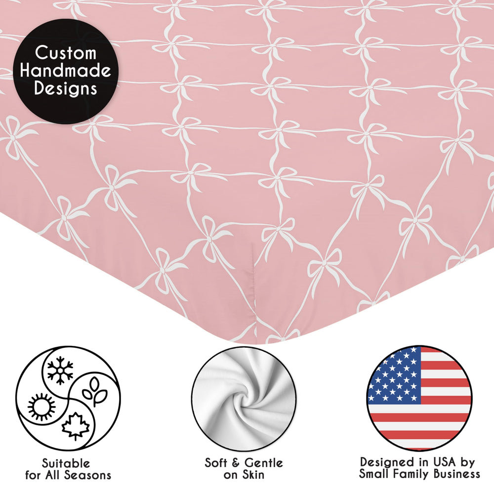Sweet Jojo Designs pink bows nursery setup, coordinating with other pieces for a cohesive room.