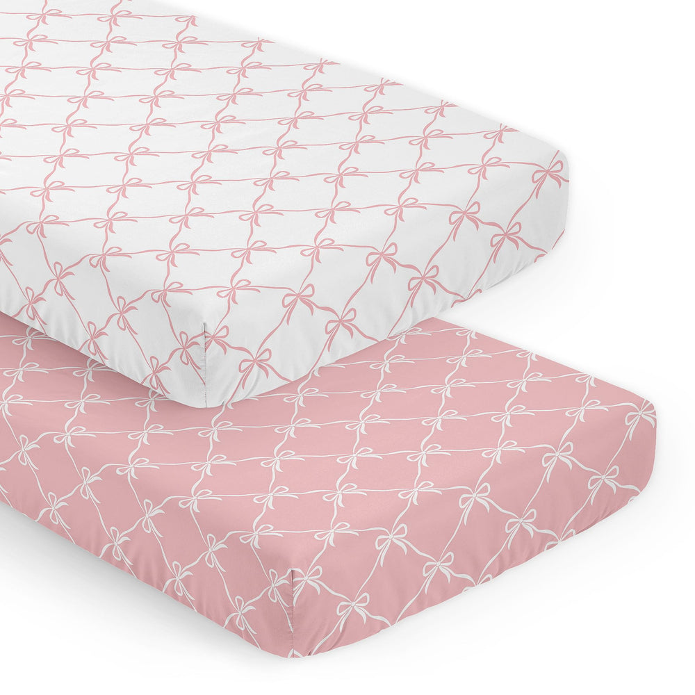 Sweet Jojo Designs pink and white bows crib sheets close-up showing soft microfiber for gentle sleep.