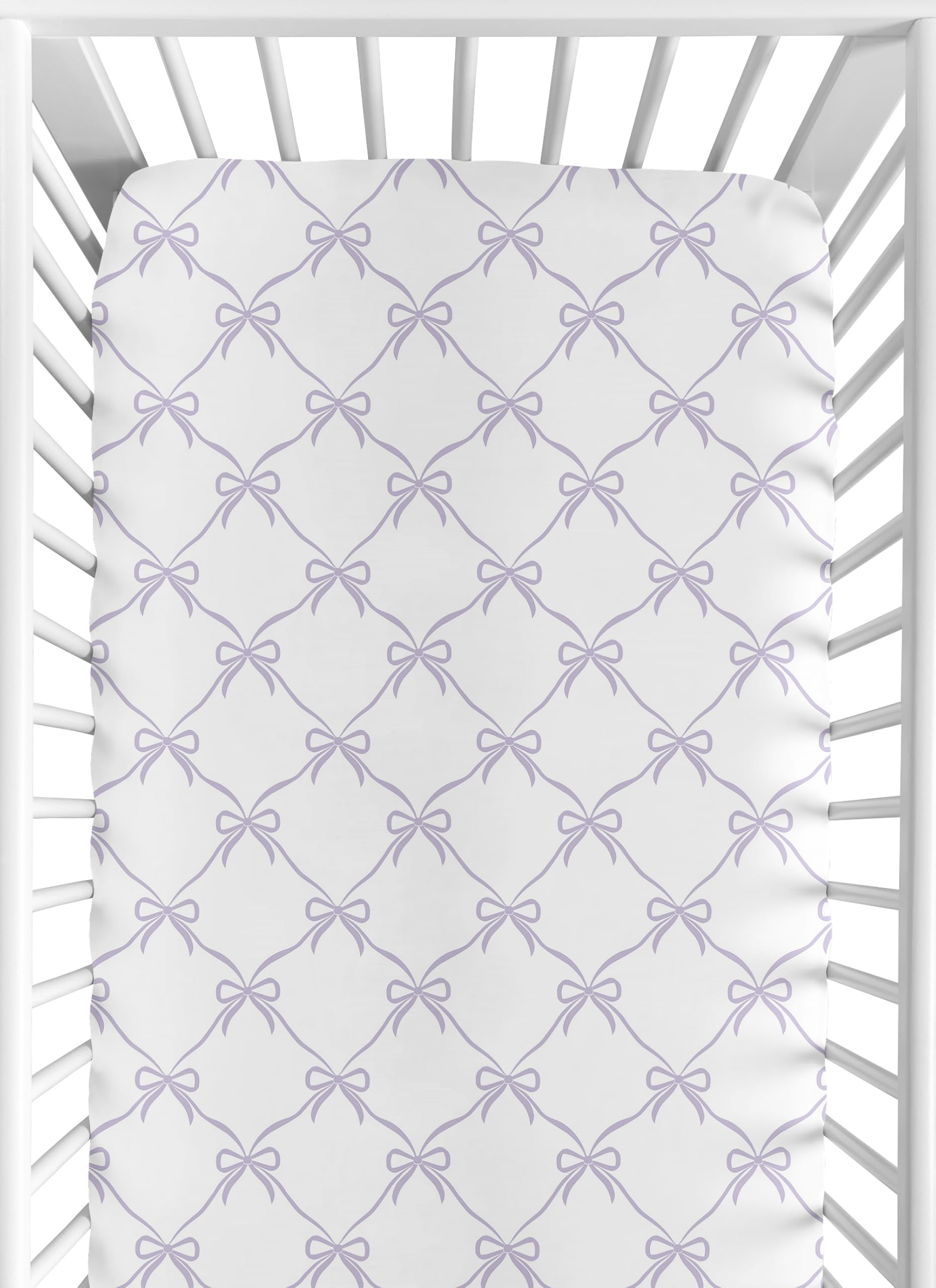 Sweet Jojo Designs purple bows fitted crib sheet showing snug fit for standard cribs.