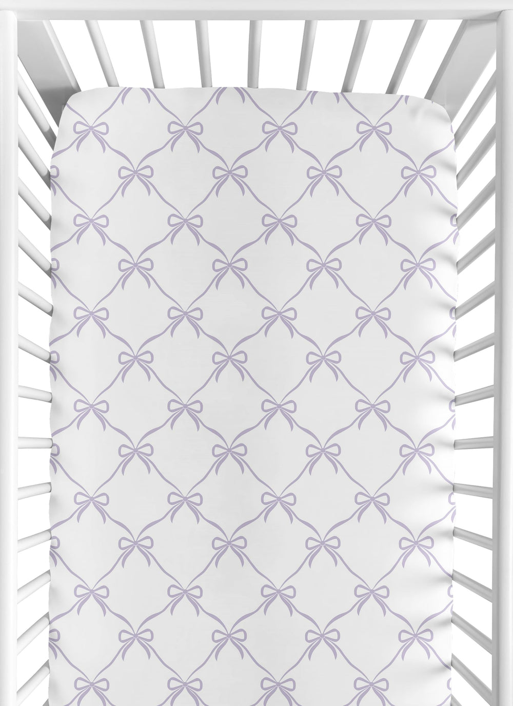 Sweet Jojo Designs purple bows fitted crib sheet showing snug fit for standard cribs.