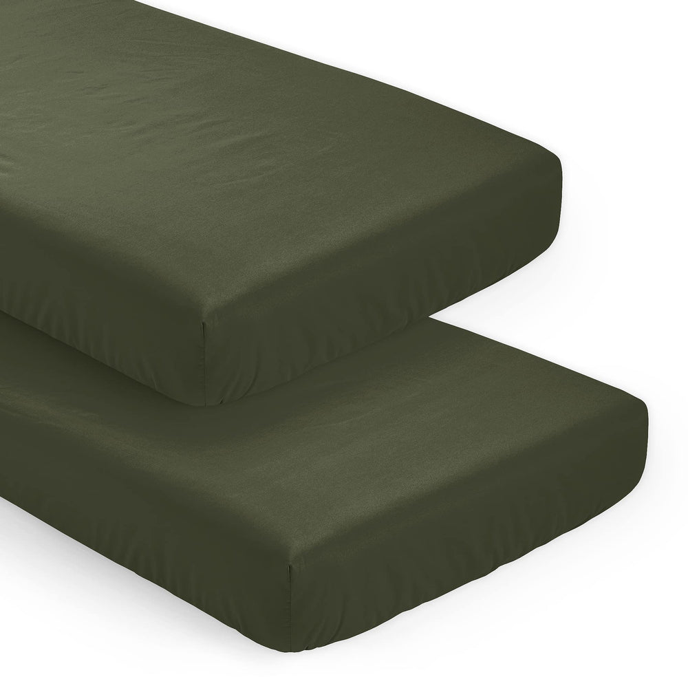 Sweet Jojo Designs solid dark green crib sheets in snug, secure fit.