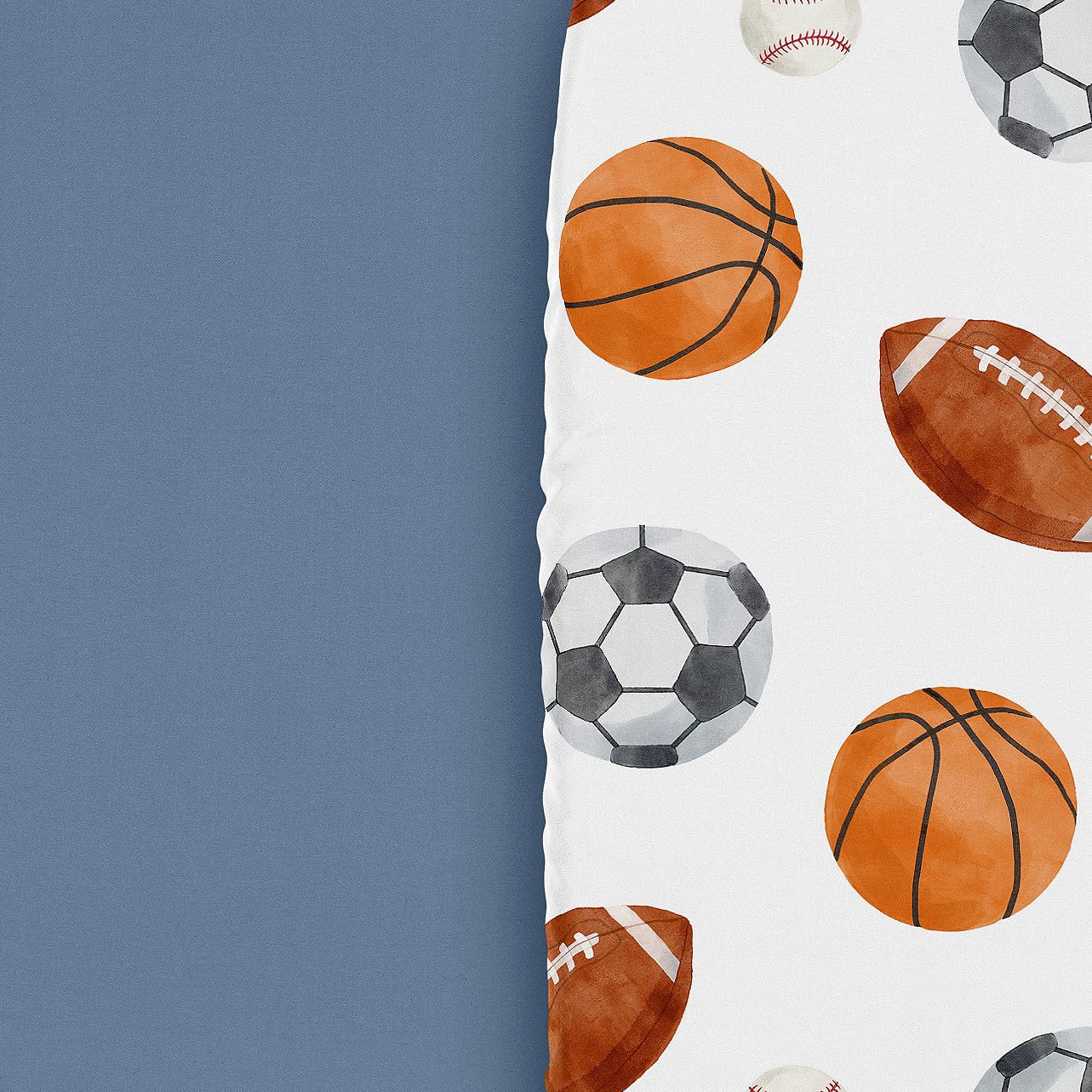 Sweet Jojo Designs sport-themed sheets enhance a coordinated, playful nursery decor.