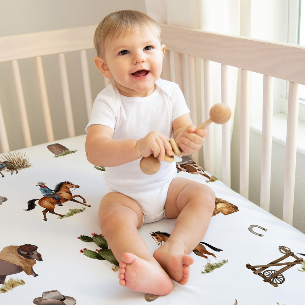 Sweet Jojo Designs tan-blue-red accents crib sheet; versatile style for nurseries.