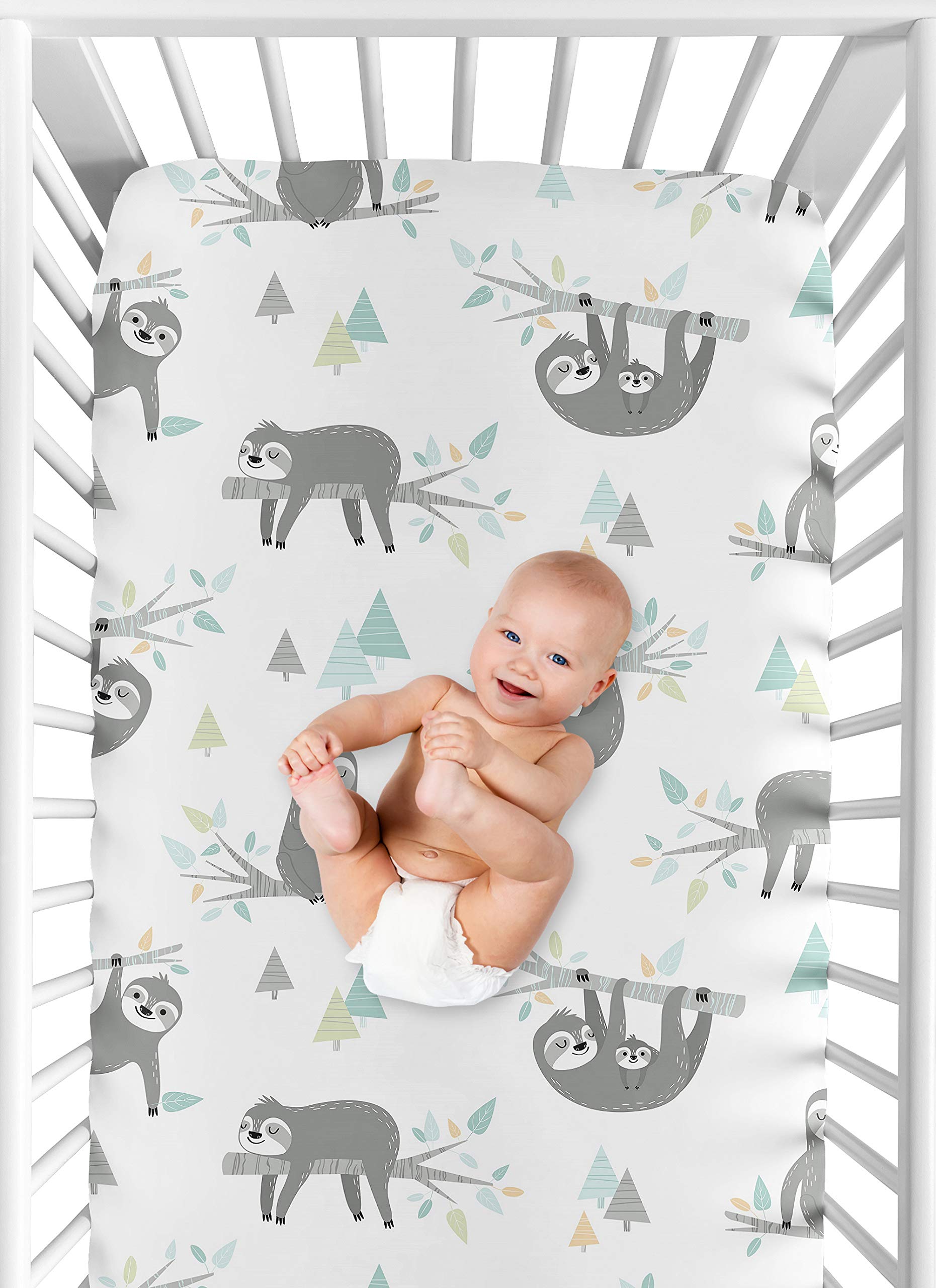 Sweet Jojo Designs turquoise-green jungle print sheet adds vibrant style to the nursery.