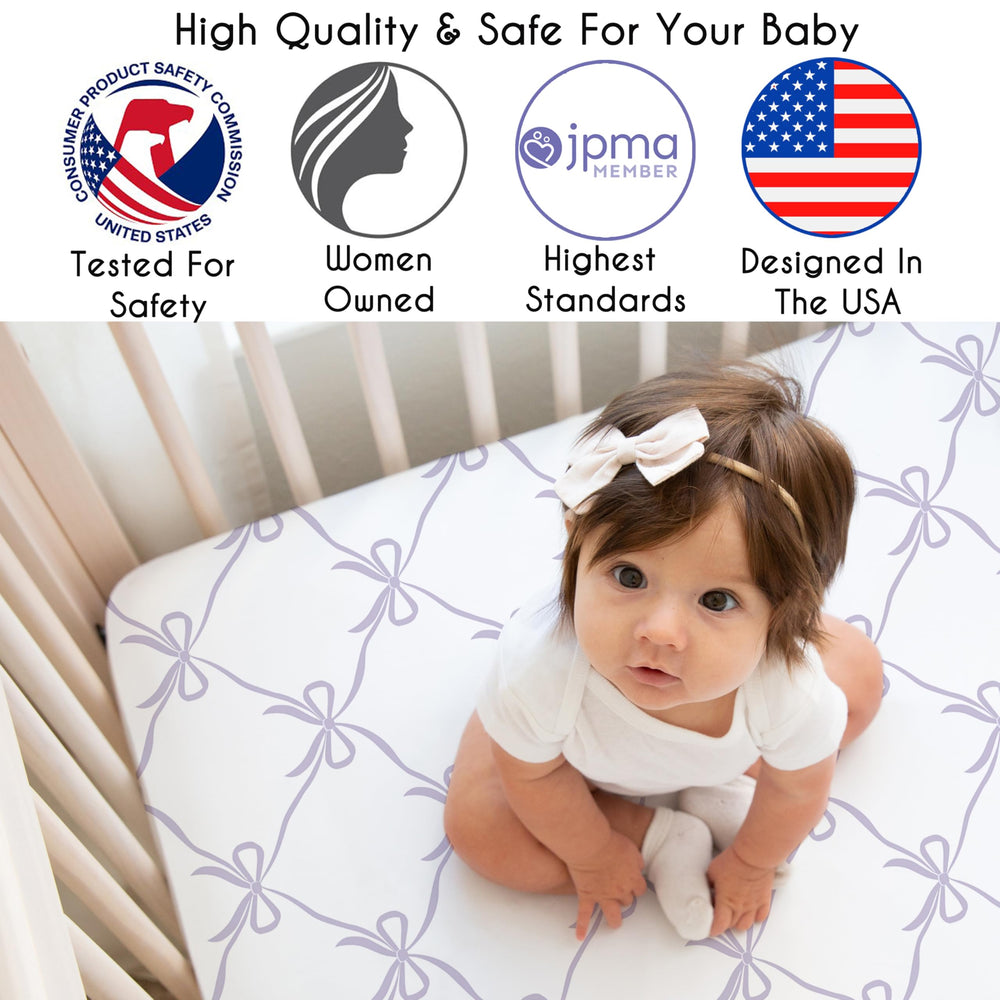 Sweet Jojo Designs white lavender bows crib design enhances calming nursery ambiance.