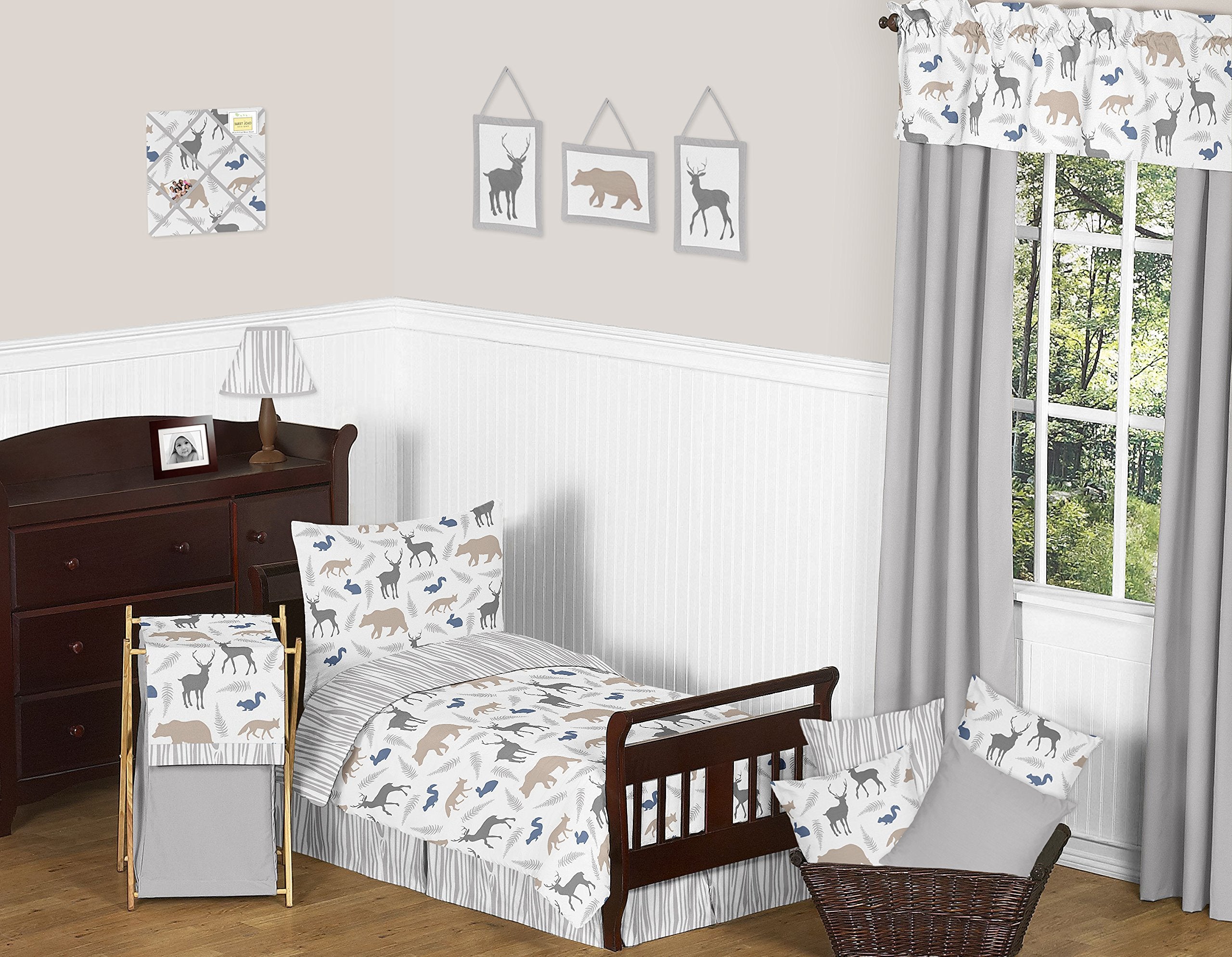 Sweet Jojo grey fabric memory board on wall with metal hanger for easy mounting.