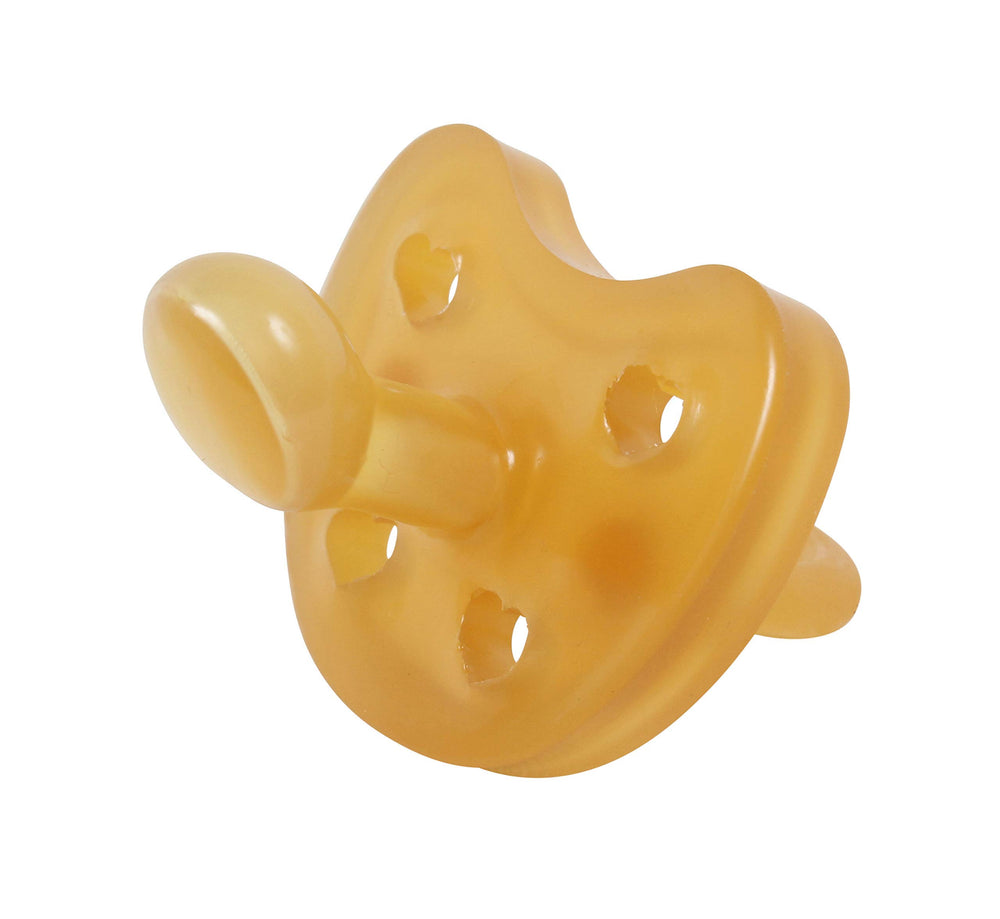Sweetie heart-shaped pacifier close-up highlights the gentle orthodontic nipple design.