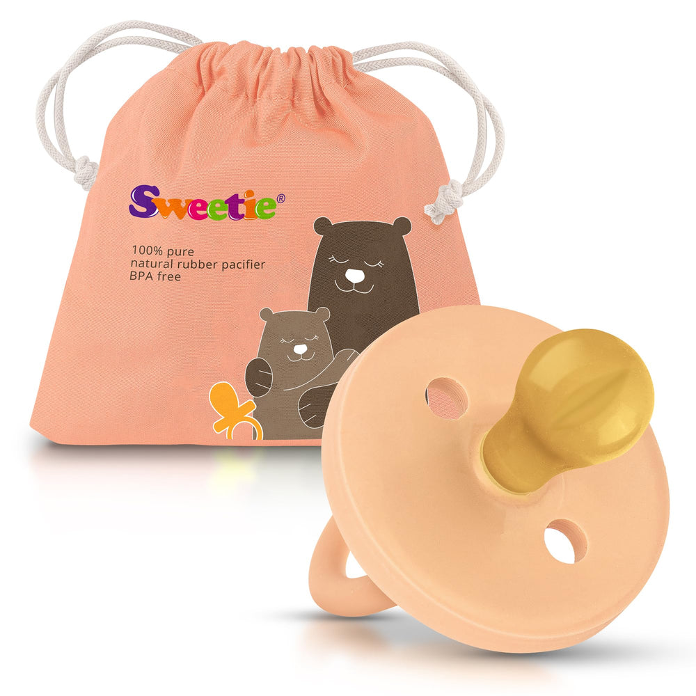 Sweetie rubber pacifier with rounded nipple, light pink, for soothing comfort during sleep.