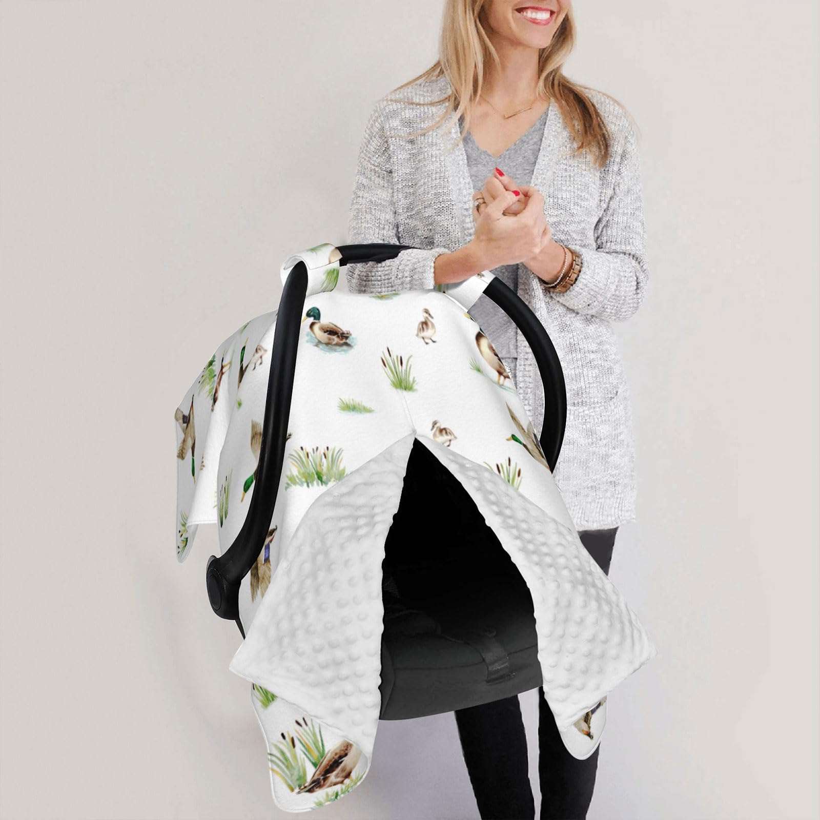 Sweety Baby multi-use cover doubles as nursing cover and blanket.