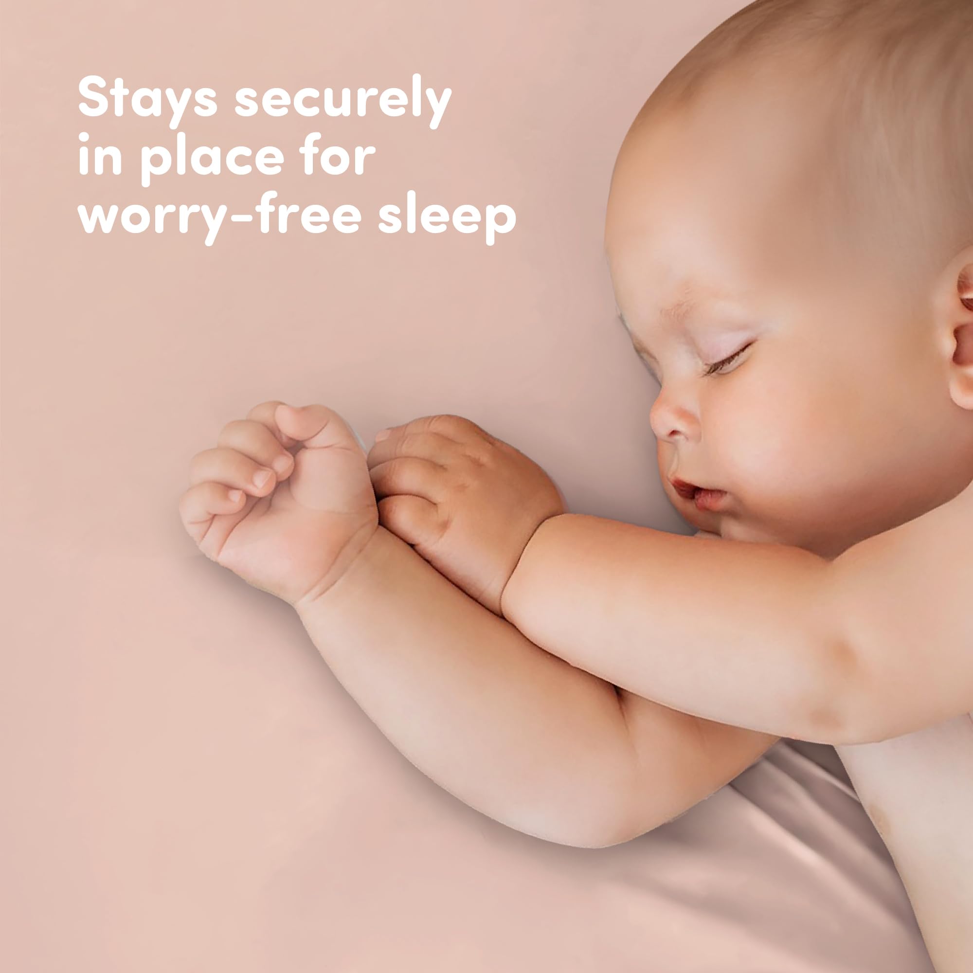 Gender-neutral white and pink crib sheets suit boys, girls, or neutral nurseries.