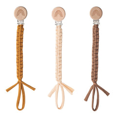 Symbolife pacifier clip close-up showing wooden teeth grip.